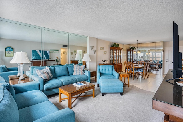 carpeted living room with a textured ceiling