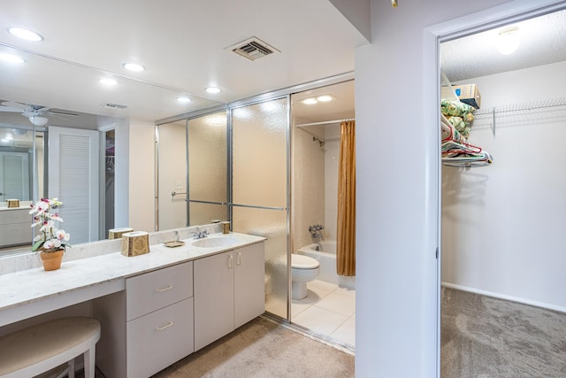 full bathroom featuring tile patterned flooring, shower / tub combo, ceiling fan, vanity, and toilet