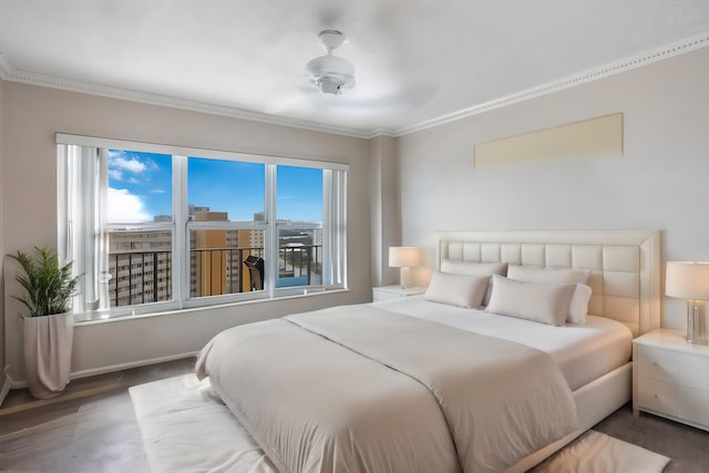 bedroom with multiple windows, ornamental molding, hardwood / wood-style floors, and ceiling fan