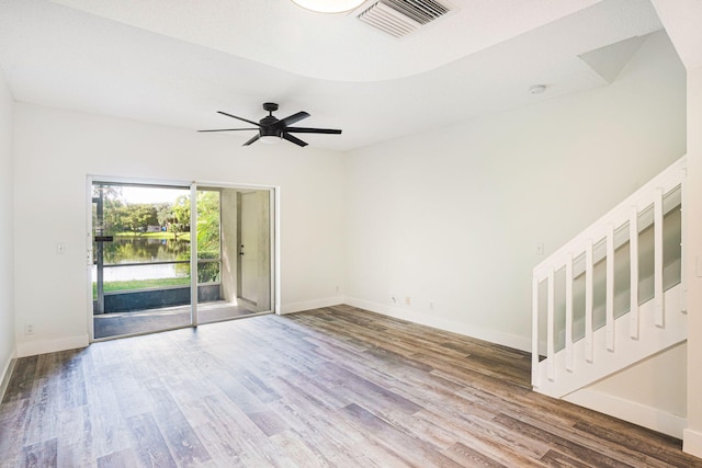 unfurnished room with wood-type flooring and ceiling fan