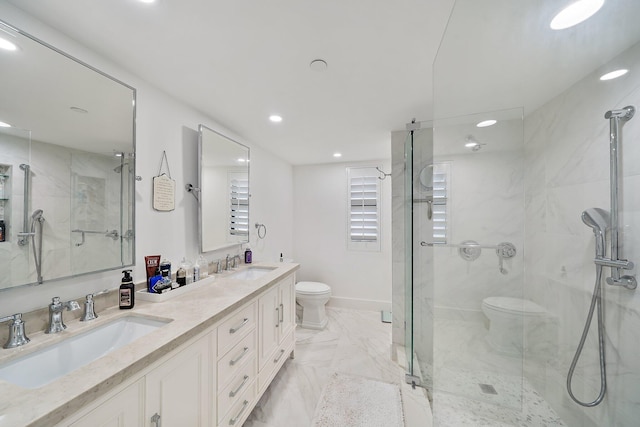 bathroom with an enclosed shower, vanity, and toilet