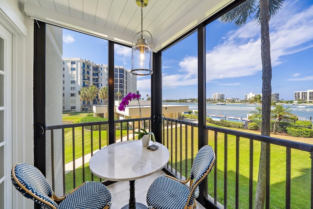 sunroom with a water view