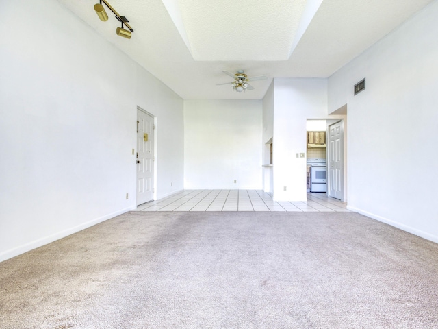 interior space with ceiling fan and a textured ceiling