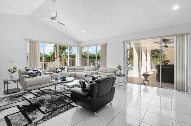 tiled living room featuring lofted ceiling, a wealth of natural light, and ceiling fan