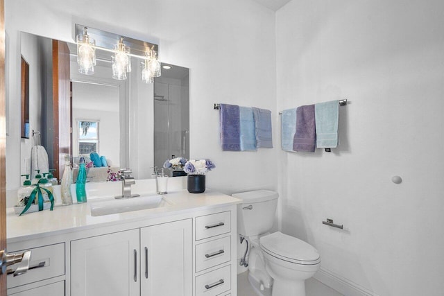 bathroom featuring toilet and vanity