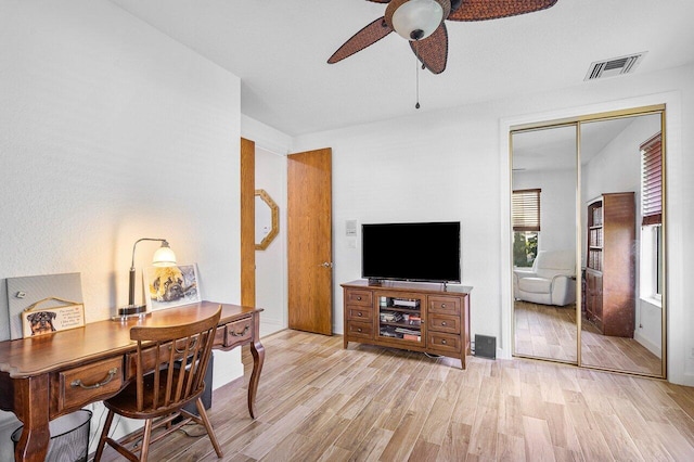 office area with ceiling fan and light hardwood / wood-style floors