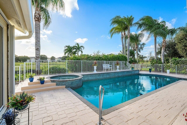 view of pool with an in ground hot tub