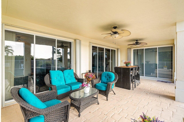 view of patio featuring ceiling fan and an outdoor hangout area