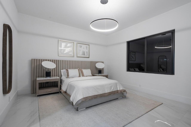 bedroom featuring an inviting chandelier