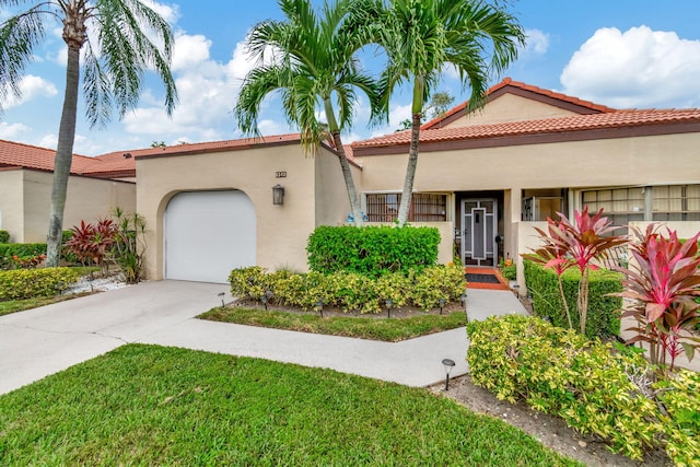 mediterranean / spanish-style home featuring a garage