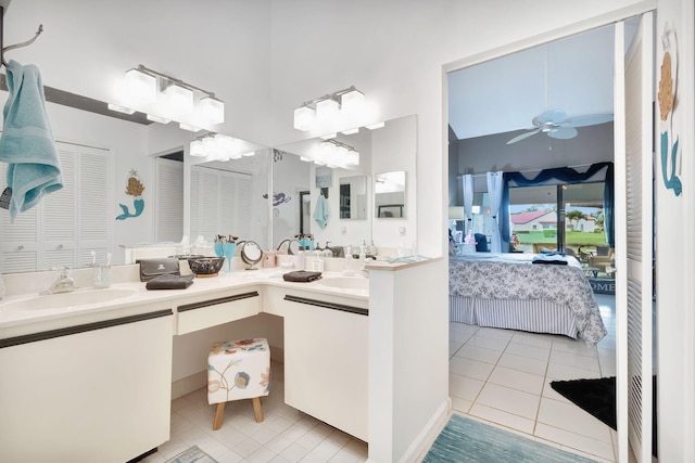 bathroom with ceiling fan, vanity, and tile patterned floors