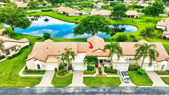 bird's eye view with a water view