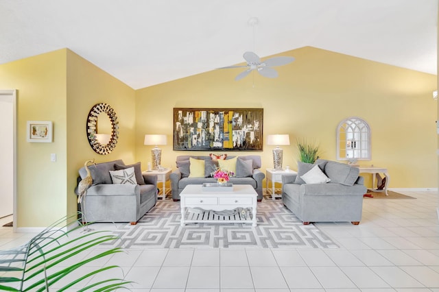 living room featuring ceiling fan, light tile patterned floors, and vaulted ceiling