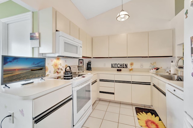 kitchen featuring pendant lighting, white appliances, light tile patterned floors, and white cabinets