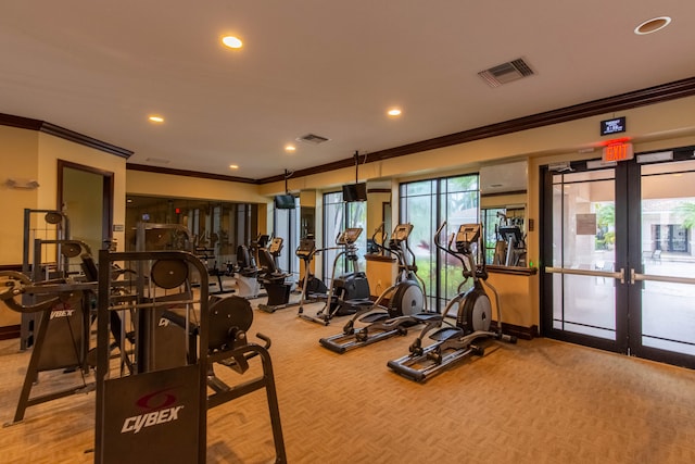 exercise room featuring ornamental molding and french doors