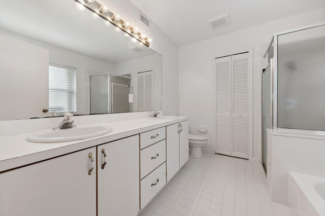 full bathroom with tile patterned floors, vanity, toilet, and shower with separate bathtub