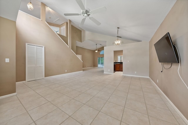 unfurnished living room featuring ceiling fan, high vaulted ceiling, and light tile patterned floors