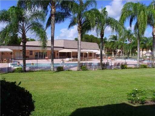 view of yard with a community pool