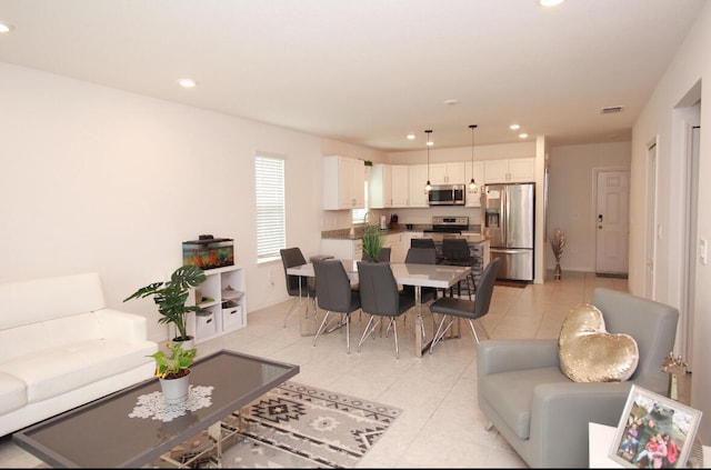 living room with light tile patterned floors