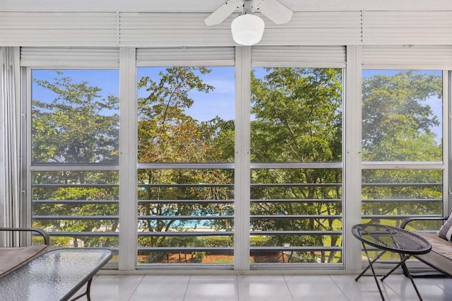 sunroom with a wealth of natural light and ceiling fan