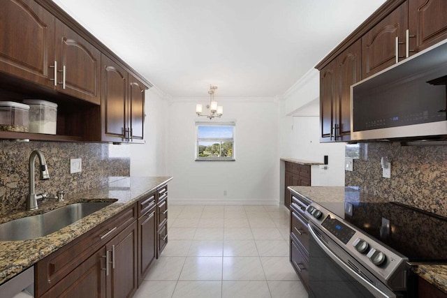 kitchen with dark brown cabinetry, ornamental molding, sink, stone countertops, and appliances with stainless steel finishes