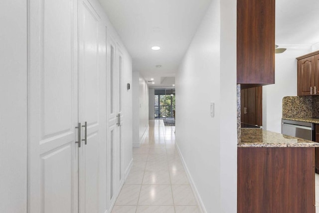 hallway featuring light tile patterned flooring