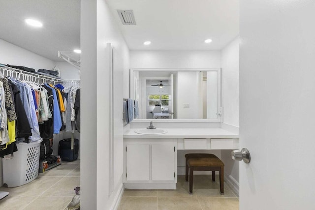 bathroom featuring tile patterned flooring, ceiling fan, and vanity