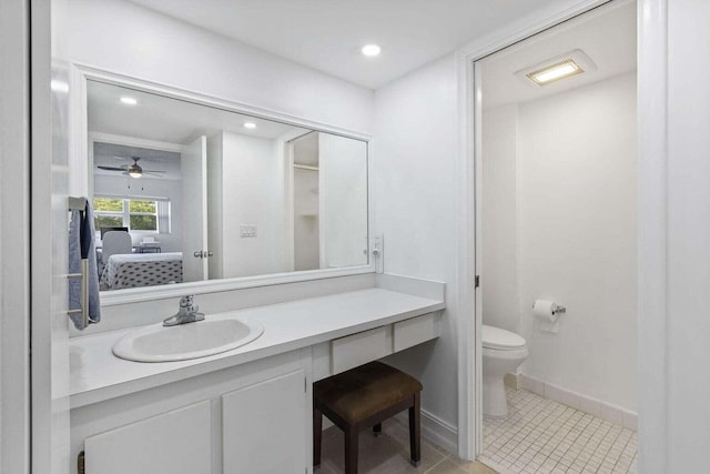 bathroom featuring tile patterned flooring, ceiling fan, vanity, and toilet