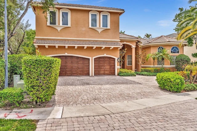 mediterranean / spanish-style house featuring a garage