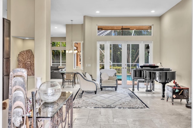 interior space with french doors and a high ceiling