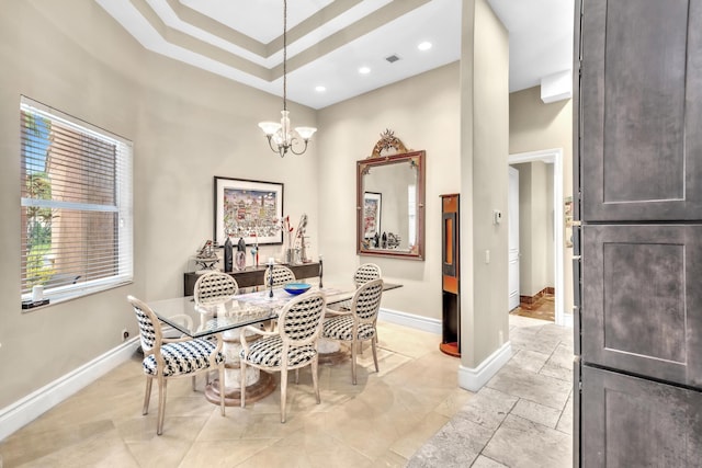 dining space with a notable chandelier