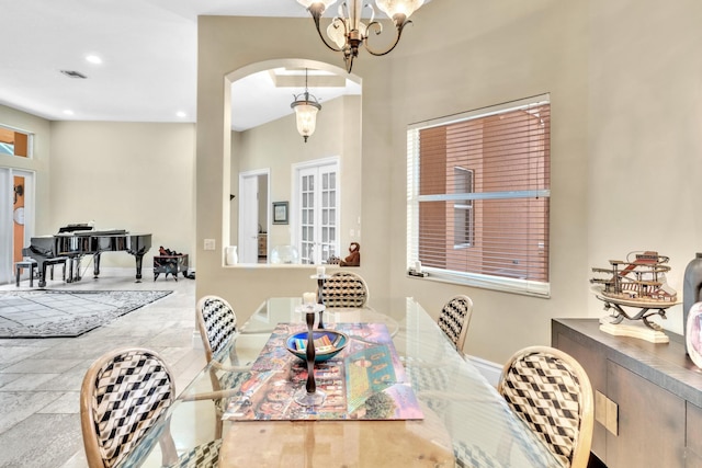 dining area featuring a notable chandelier