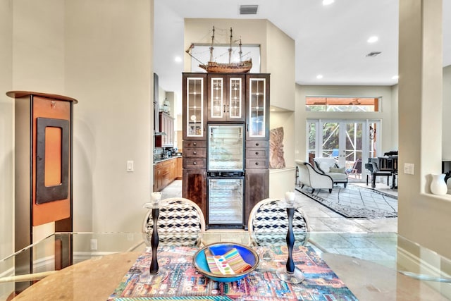 interior space featuring french doors and beverage cooler