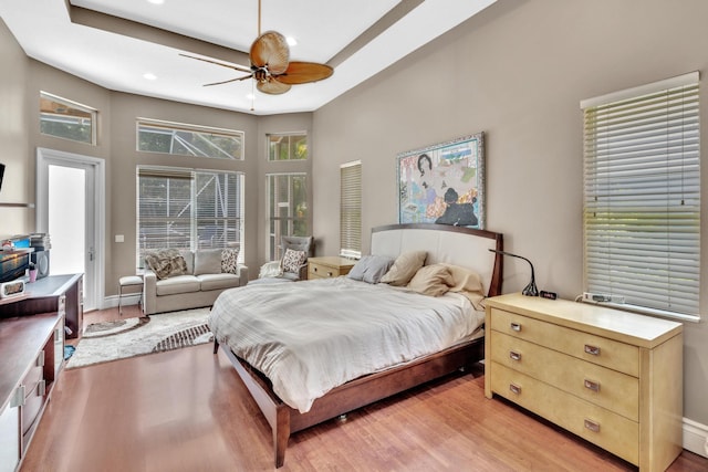 bedroom featuring ceiling fan and light hardwood / wood-style flooring