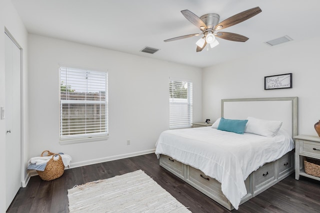 bedroom featuring dark hardwood / wood-style floors and ceiling fan