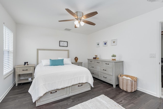 bedroom featuring ceiling fan and dark wood-type flooring