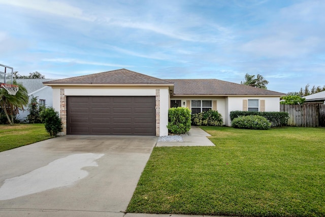 ranch-style home with a garage and a front lawn