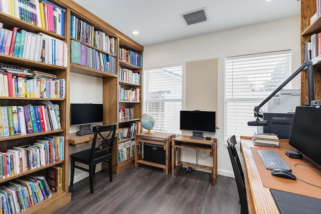 office featuring plenty of natural light and dark hardwood / wood-style floors