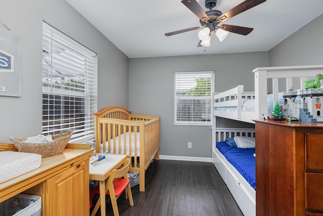 bedroom featuring ceiling fan and dark wood-type flooring