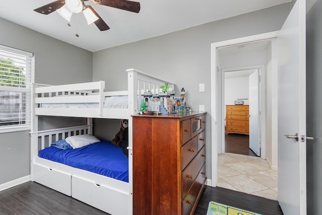 bedroom with hardwood / wood-style floors and ceiling fan