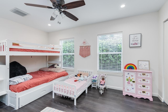 bedroom with ceiling fan and dark hardwood / wood-style flooring