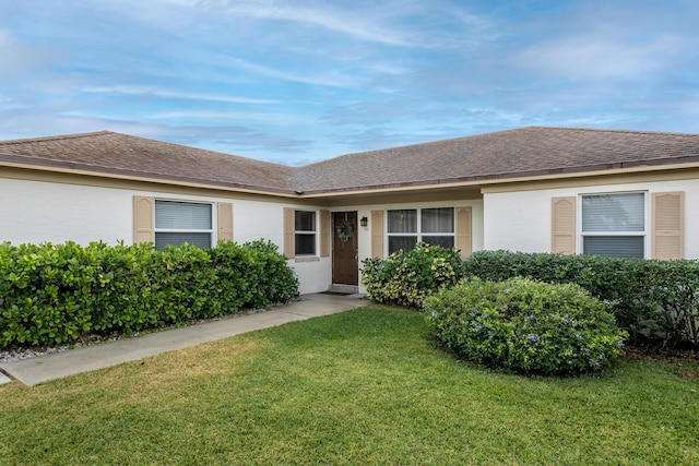 ranch-style home with a front yard