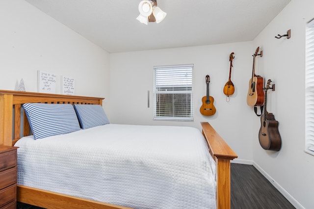 bedroom featuring dark hardwood / wood-style flooring