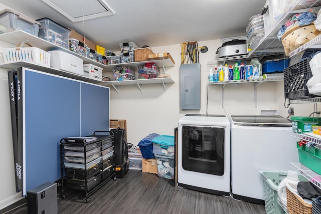 laundry area featuring electric panel, dark wood-type flooring, and washing machine and dryer