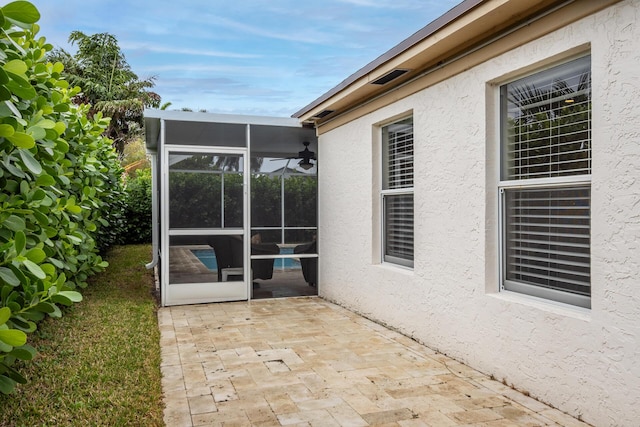 view of patio / terrace with a sunroom