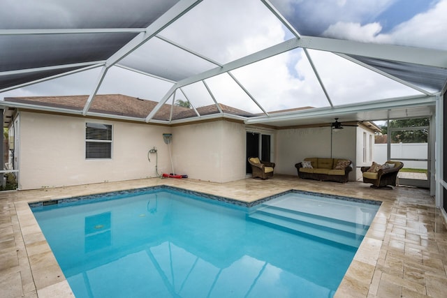 view of swimming pool featuring a lanai, an outdoor living space, ceiling fan, and a patio