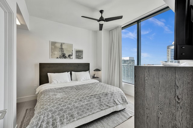 601 NE 1st Ave Unit 4813, Miami, FL 33132 - bedroom with baseboards, ceiling fan, and tile patterned flooring