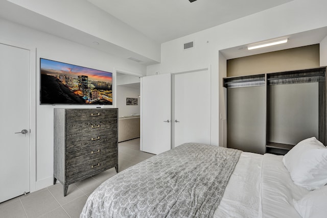 601 NE 1st Ave Unit 4813, Miami, FL 33132 - bedroom with light tile patterned floors and a closet