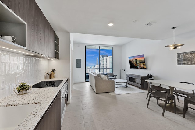 601 NE 1st Ave Unit 4813, Miami, FL 33132 - kitchen with modern cabinets, open shelves, black electric stovetop, tasteful backsplash, and dark brown cabinetry