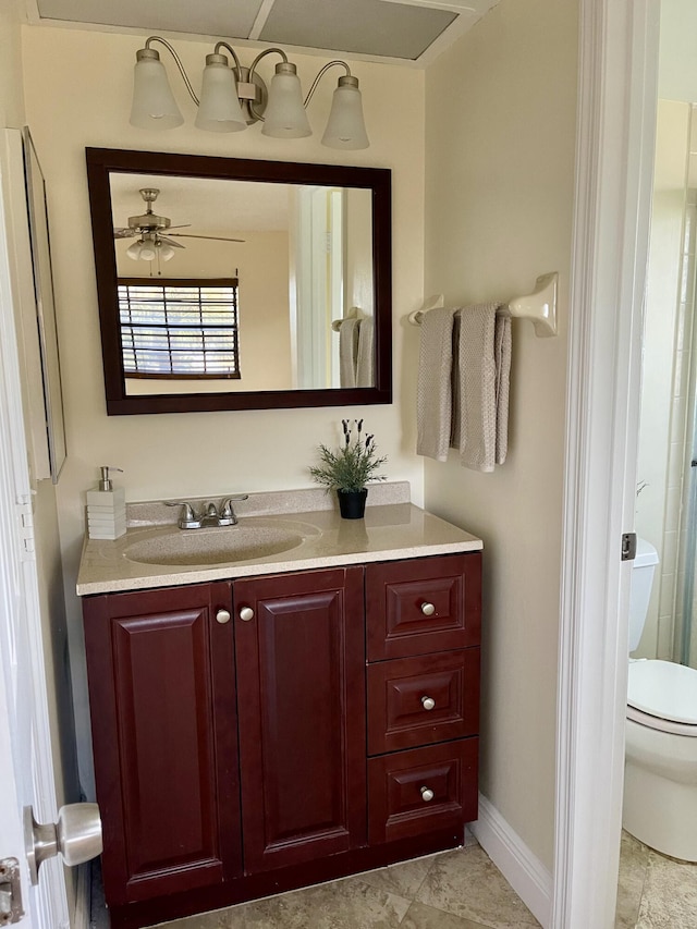 bathroom with ceiling fan, vanity, and toilet